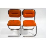 A pair of 1970's Continental chrome and vinyl chairs