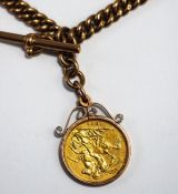 A double watch chain, of hollow curb links, stamped '9ct', with two swivels and a T bar, 39 cm long,