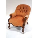 A Victorian walnut frame button back armchair, with scroll arms,