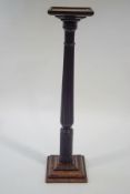 A 19th Century mahogany torchere, with reeded and acanthus leaf column,