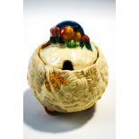 A Clarice Cliff Newport Pottery jam pot and cover, of globe form with harvest decoration, 11.
