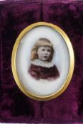 A Victorian portrait miniature of a young girl, hand painted over a base printed on bisque,