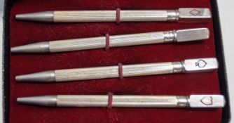 A cased set of four bridge pencils, stamped 'Sterling Silver', 8.
