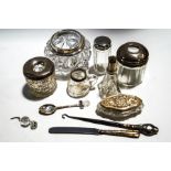 Two silver mounted cut glass hat pin jars, an oval cut glass box with embossed silver cover,