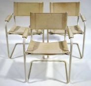 A set of three modern white leather and tubular steel chairs