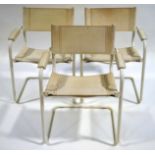 A set of three modern white leather and tubular steel chairs
