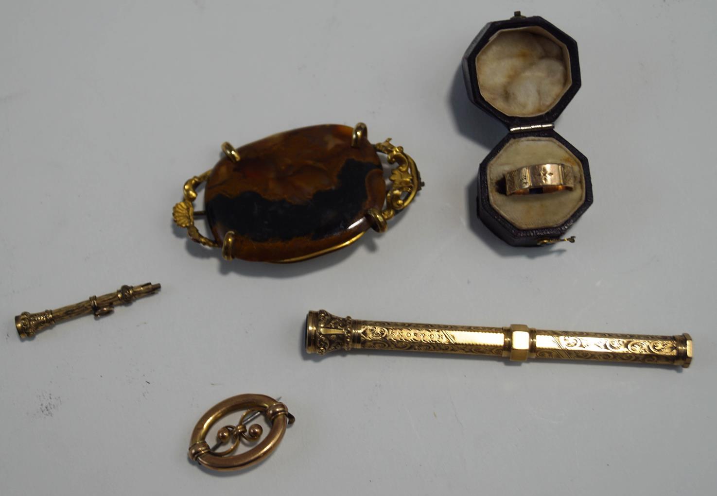 A 9 carat gold ring, cut, in a Victorian ring box, 2.2 g gross; with a brooch, stamped '9ct', 2.