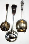 A silver tea strainer, Sheffield 1943, a silver sugar sifter spoon,