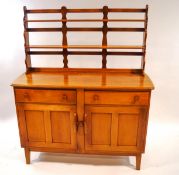 An Ercol style sideboard with plate rack,