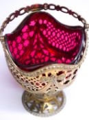 A Victorian silver gilt basket with cranberry glass liner, makers stamp J.H.