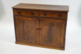 A Victorian mahogany two drawer side cupboard,