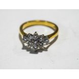 A nine stone diamond 18 carat gold cluster ring, 2001, the brilliant cuts totalling approximately 0.