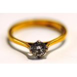 A single stone diamond 18 carat gold ring, the brilliant cut of approximately 0.