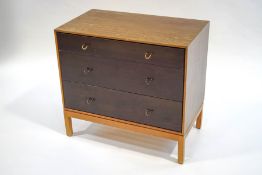 A Stag chest of three long drawers, with brass loop handles,