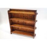 A late 19th century oak bookcase with four shelves of pegged construction,