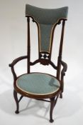 A late Victorian mahogany high back armchair,