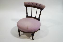 A Victorian pink upholstered low chair,