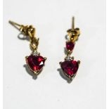 A pair of synthetic ruby and diamond drop earrings