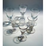 Three late 19th Century glasses engraved with vine leaves, and three early 19th Century glasses,