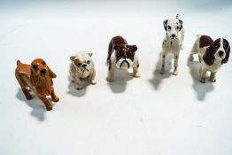 Five Beswick figure of a Dalmation, two Bull dogs and two Spaniels,