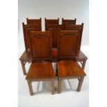 A set of eight modern oak dining chairs,