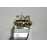 A seven stone diamond 18 carat gold half hoop ring,