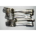 A collection of seven Victorian silver fiddle pattern dessert forks and two silver dining forks,