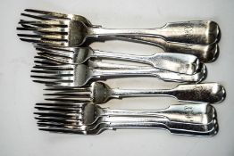 A collection of seven Victorian silver fiddle pattern dessert forks and two silver dining forks,