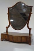 A 19th Century mahogany dressing table mirror, the shield shape mirror upon a serpentine base,