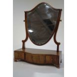 A 19th Century mahogany dressing table mirror, the shield shape mirror upon a serpentine base,