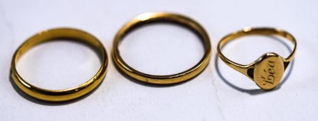 A 9 carat gold wedding ring; a Continental wedding ring;