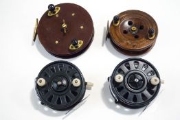 Four vintage fishing reels, including two Paramount and a wooden Eton Sun,