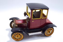 A Schuco 1227 'Old Timer' Ford Coupe 1917, tinplate and clockwork, in original box,