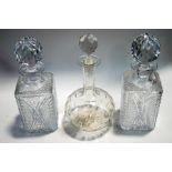 A pair of square cut glass decanters and stoppers,