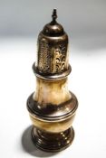 A silver vase shaped sugar caster, the pierced cover with a baluster finial,