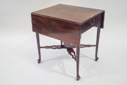 An 18th Century mahogany drop-flap pembroke table with single drawer and dummy drawer to opposite