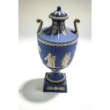 A Wedgwood pale blue Jasperware pedestal urn and cover,