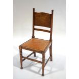 An Arts and crafts oak chair in the style of William Birch,