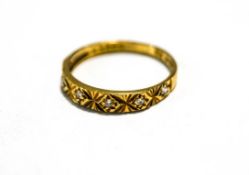 An 18 carat gold ring, 1975, set with five single cut diamonds, finger size N, 2.