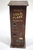 An early 20th Century oak Wills 'Gold Flake' cigarette dispenser,