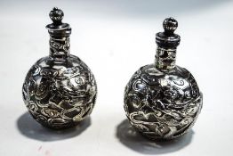 A pair of Wang Hing Chinese export silver mounted glass scent bottles,