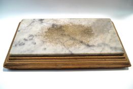 An old marble cheese board on pine stand,