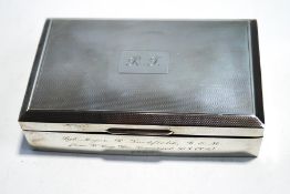 A rectangular silver cigarette case,