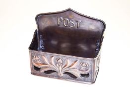 A copper hanging post box, embossed and pierced in Art Nouveau style, 23.