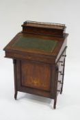 A Victorian rosewood and satinwood inlaid davenport, with green leather writing surface,
