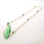 Jade, Chalcedony, Seed Pearl, Vermeil Necklace. Featuring one carved and pierced jadeite plaque