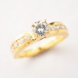 Diamond, 18k Yellow Gold Ring. Centering one round brilliant-cut diamond weighing approximately 0.45