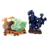Two Hardstone Carvings Comprising a lapis lazuli carving of a figural group, and a green and