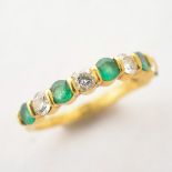 Tiffany & Co. Diamond, Emerald, 18k Yellow Gold Ring. Featuring five full-cut diamonds weighing a