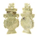 A Pair of Large Fluorite Carvings Of flattened form, carved in relief to depict dragons and other